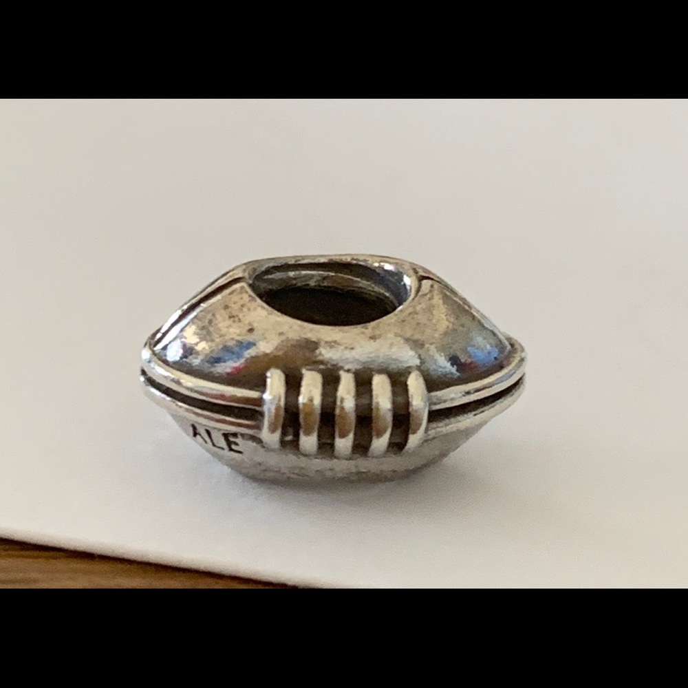 Pandora sterling silver retired football Charm.